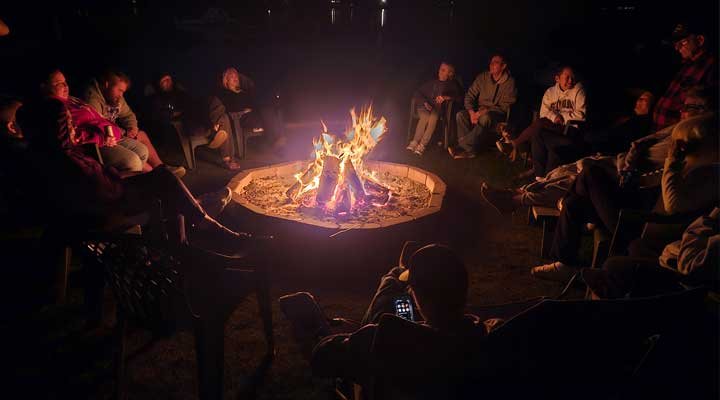 Family group sitting around the campfire